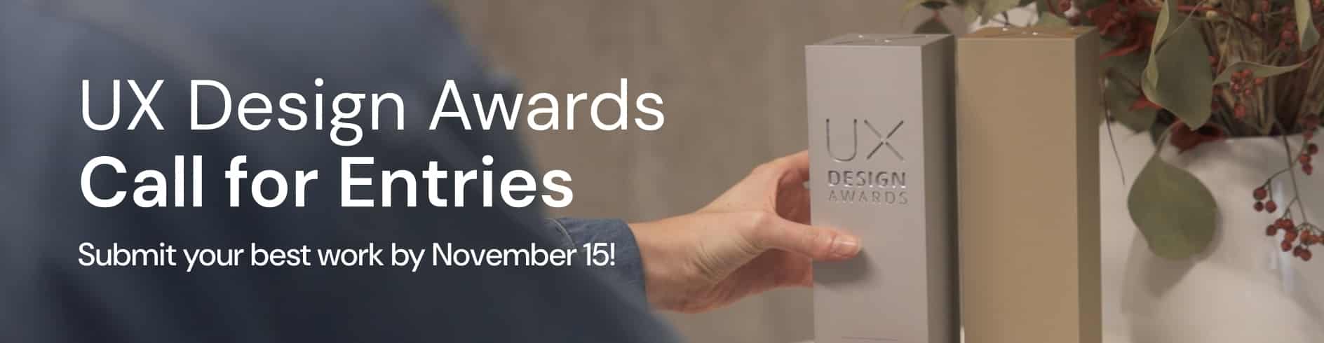 Hand greift nach einer Award-Stele der UX Design Awards, daneben der Schriftzug Call for Entries